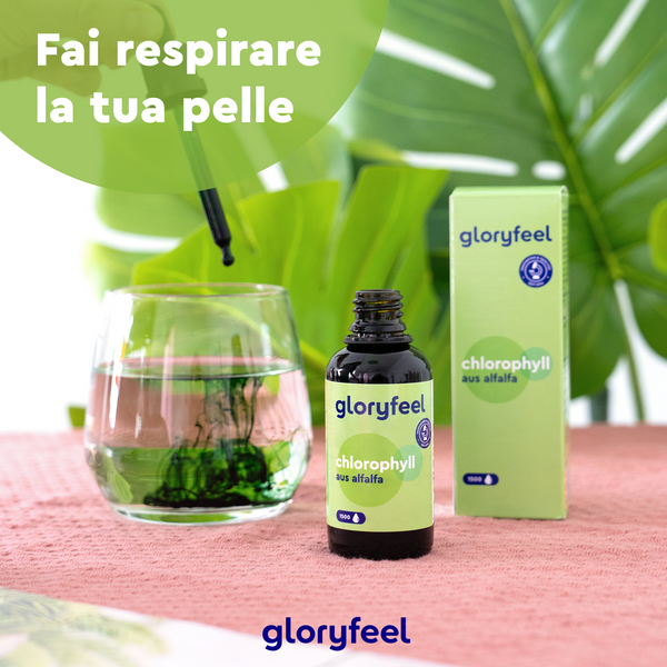 Una bottiglia e una scatola di Clorofilla in gocce di GloryFeel GmbH Italy con un contagocce sopra un bicchiere d&